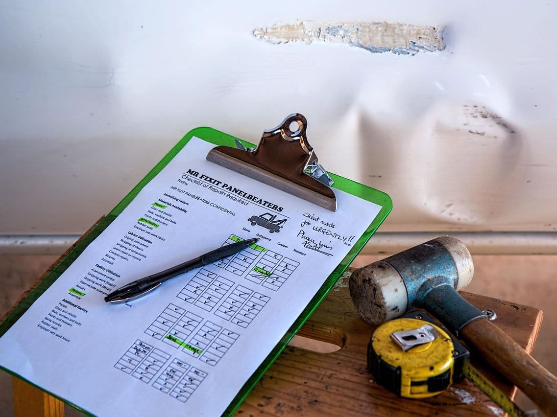 Business owner reviewing compliance reports prepared automatically