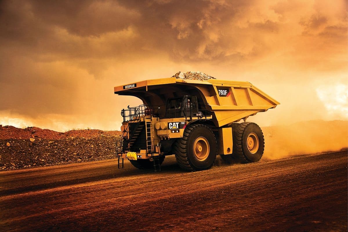 Haul truck on a mine site, field data flowing to payroll, job cost and invoicing