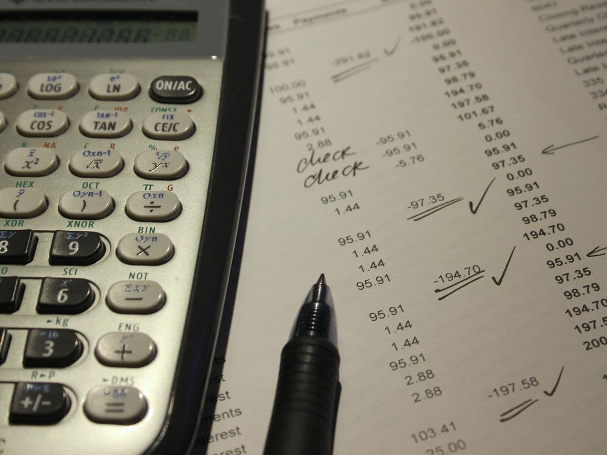 Business owner reviewing a weekly cash flow forecast built from accounting data